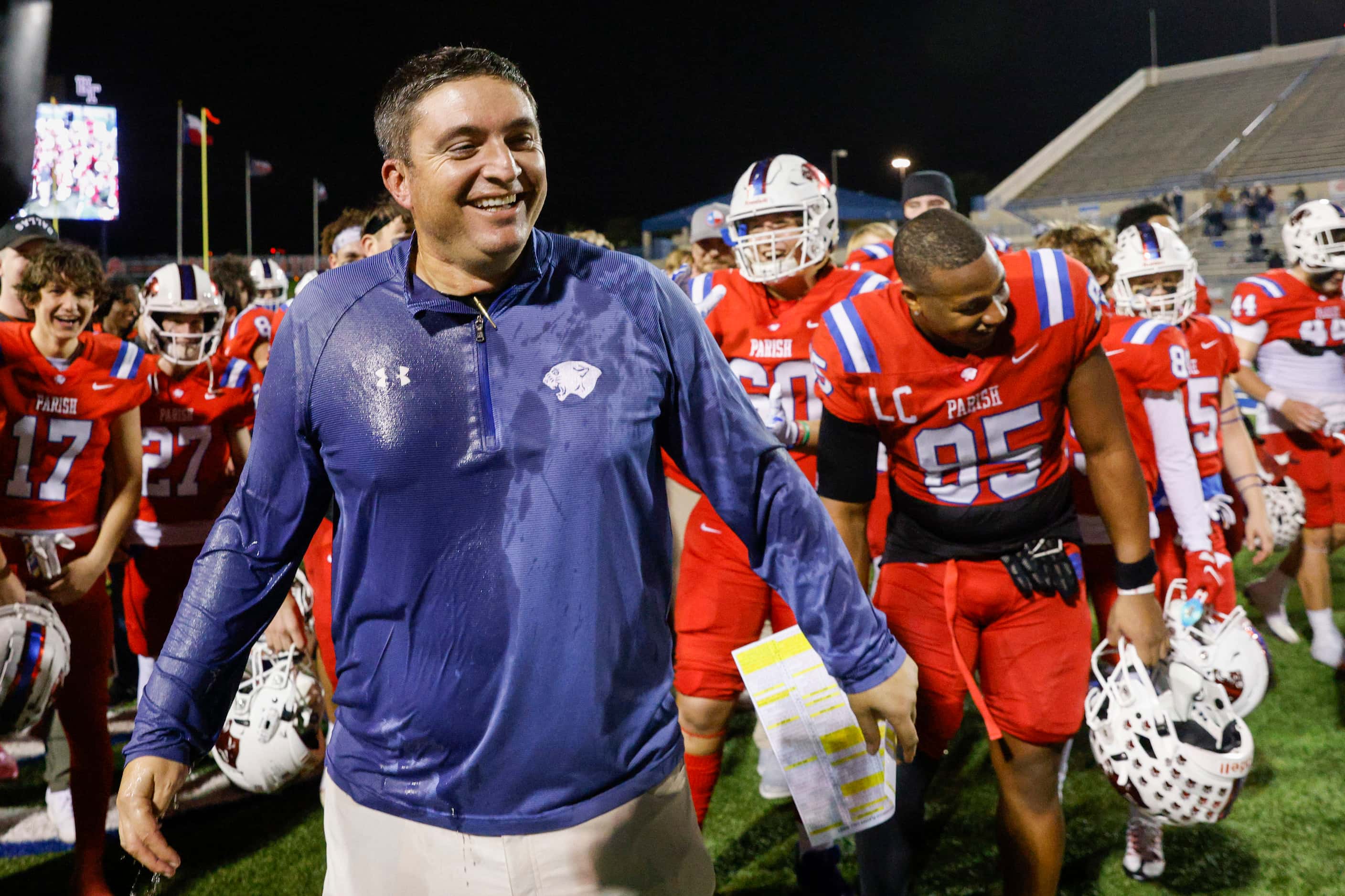 Parish Episcopal head coach Daniel Novakov smiles after being doused with an ice cooler...