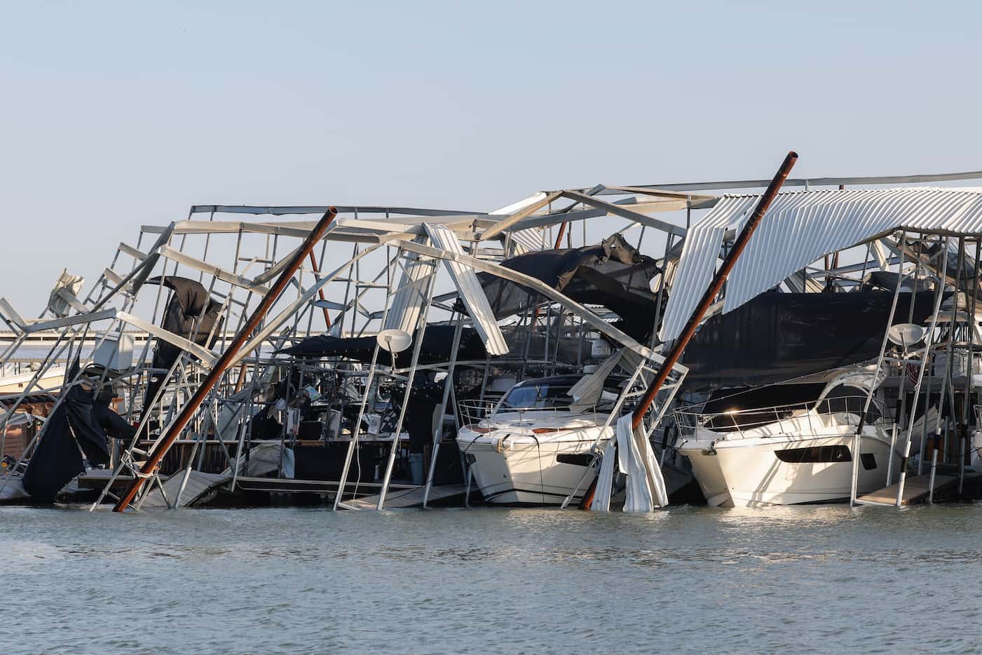 Heavy damage seen at a Lake Lewisville marina in Lewisville on Friday, Mar. 3, 2023, after...