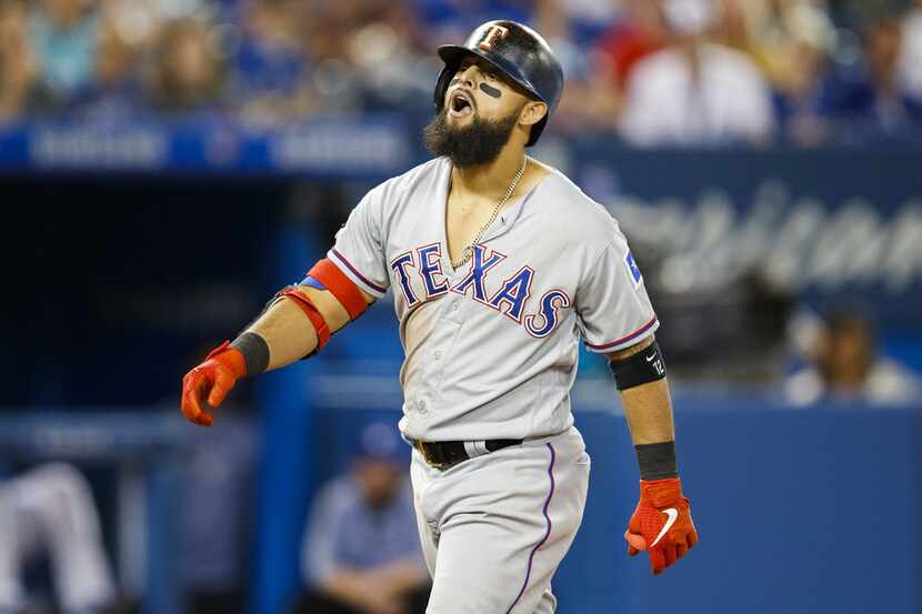 TORONTO, ONTARIO - AUGUST 12: Rougned Odor #12 of the Texas Rangers reacts to boos from the...