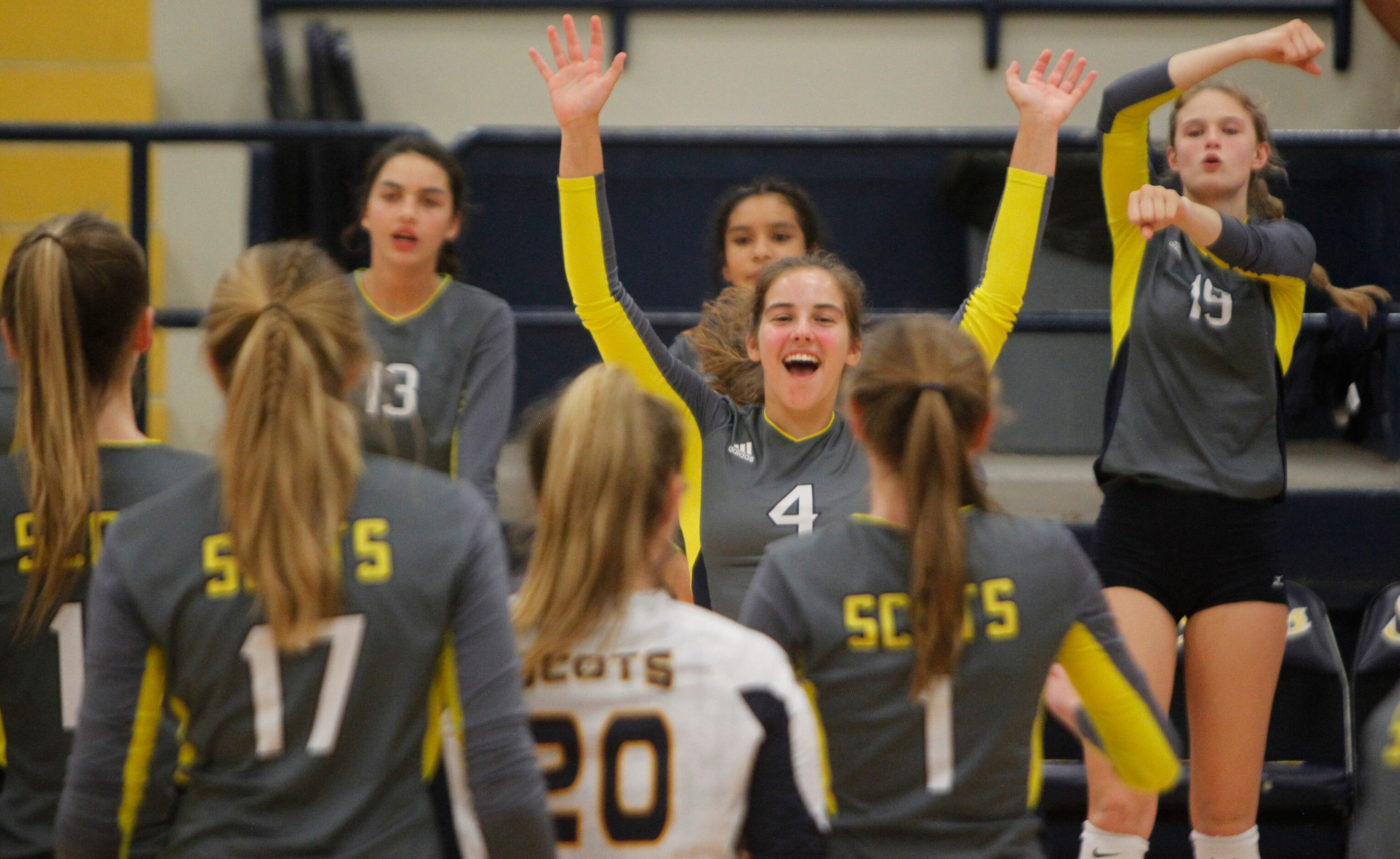 Highland Park Scots players Maren Hamilton (4), center, and Emily Hellmuth (19), right, lead...