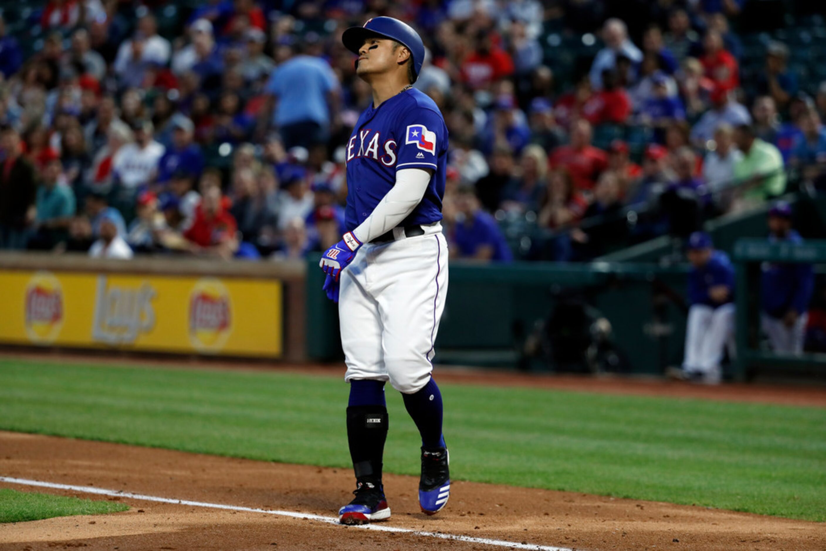 Texas Rangers' Shin-Soo Choo stops and turns to the infield after striking out against the...