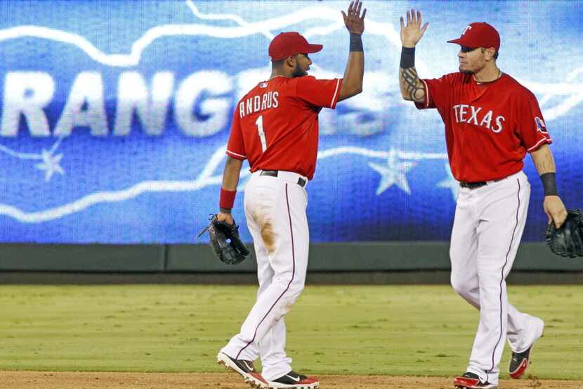 Texas SS Elvis Andrus and CF Josh Hamilton celebrate the Rangers' 2-0 win during the Tampa...
