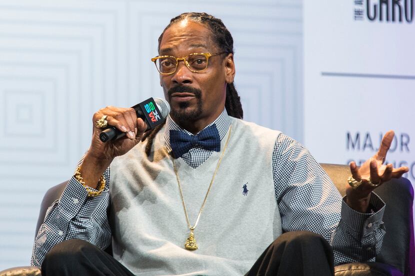 Rapper Snoop Dogg is interviewed by his manager, Ted Chung (not pictured), during the SXSW...
