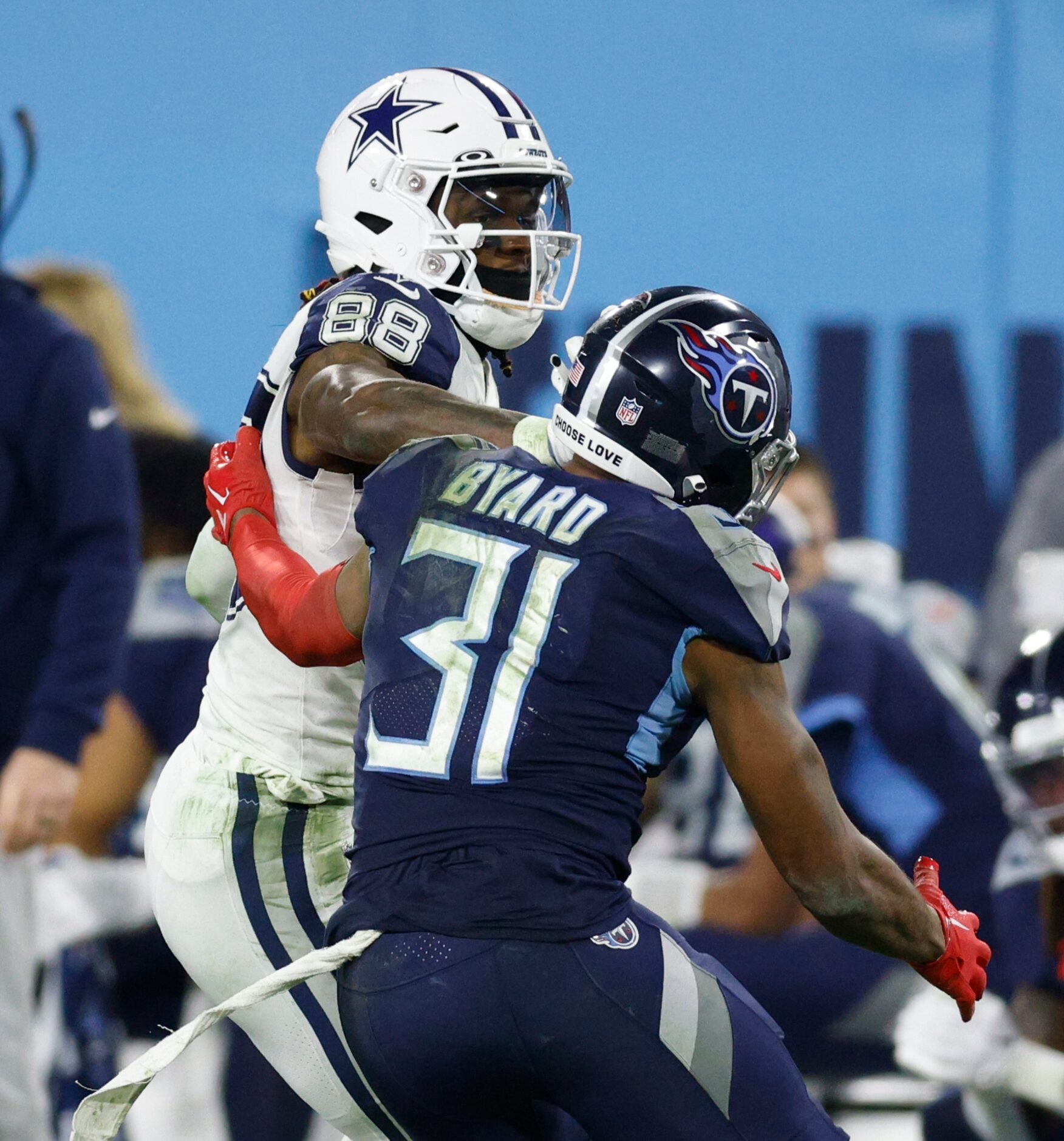 Dallas Cowboys wide receiver CeeDee Lamb (88) stiff arms Tennessee Titans safety Kevin Byard...