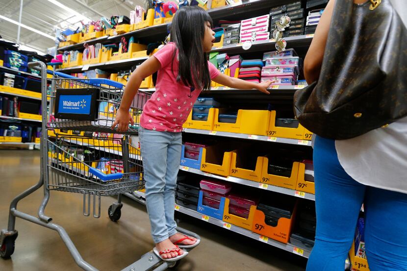 Isis Pangelinan, 6, picks out supplies  during back-to-school shopping at Walmart at Timber...