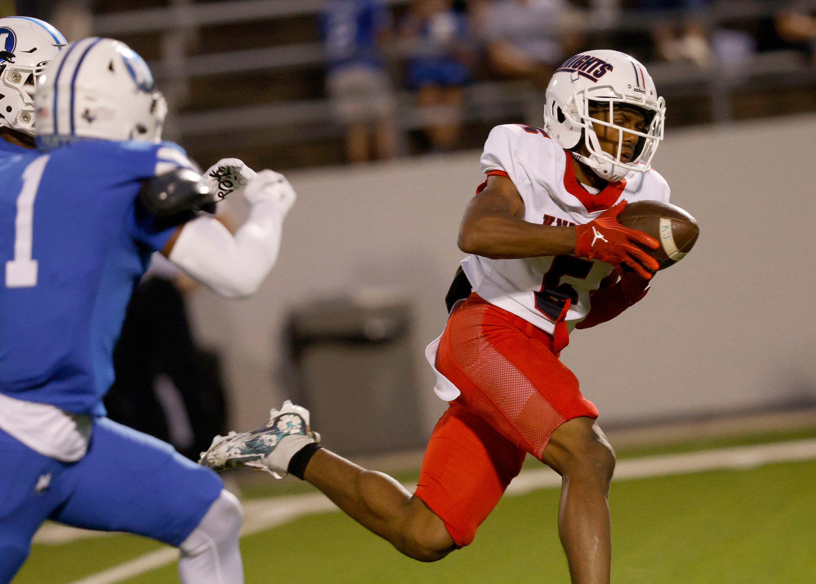 Kimball's Camrin Jackson (5) runs into the end zone for a touchdown in the first half of a...