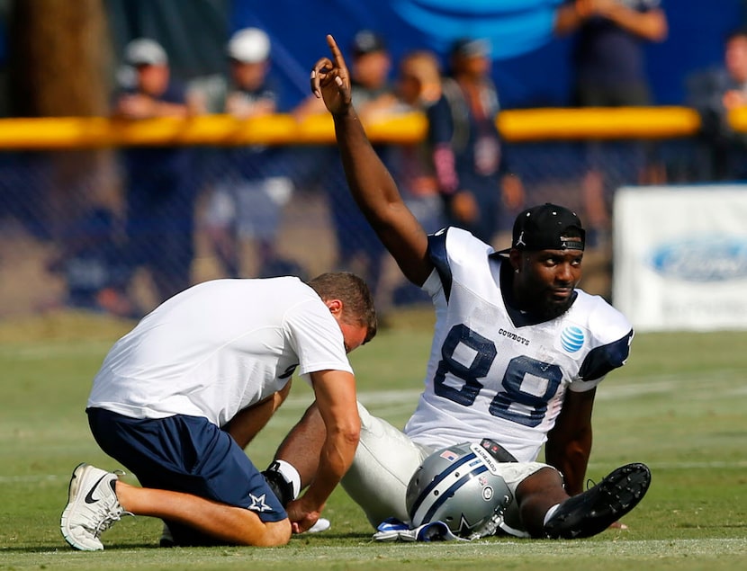 Dallas Cowboys wide receiver Dez Bryant (88) raises his finger after a teammate made a...