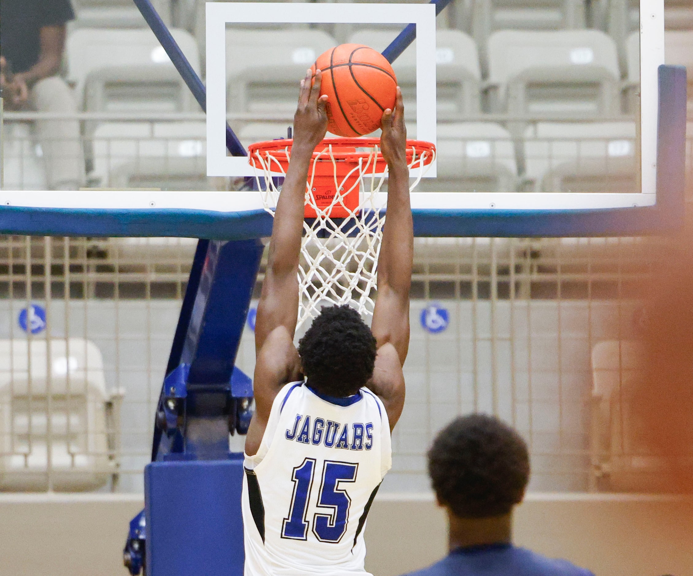 Mansfield Summit’s Ian Sedah dunks against Denton Ryan during the second half of Class 5A...