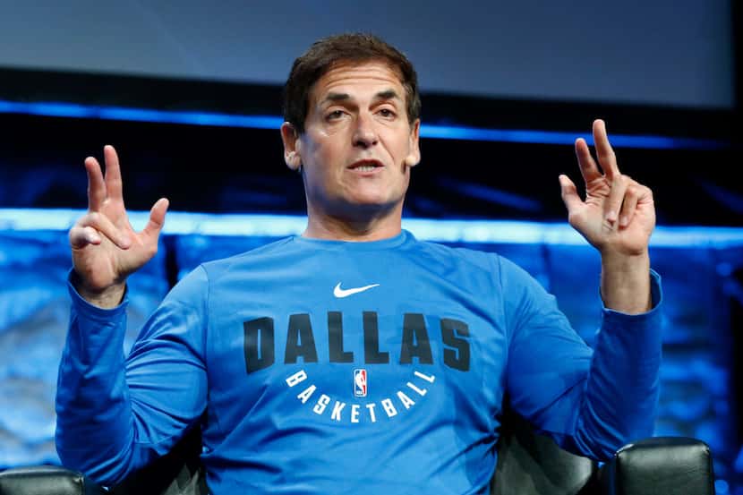 
Dallas Mavericks owner Mark Cuban, right, answers question from Scott Murray during the...