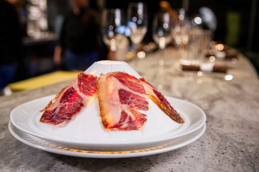 Ibérico Bellota-Bellota is served on a volcano-shaped dish with a lighted candle inside.