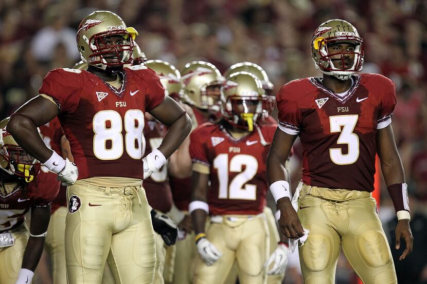 Beau Reliford #88 of the Florida State Seminoles and EJ Manuel #3 at Doak Campbell Stadium...