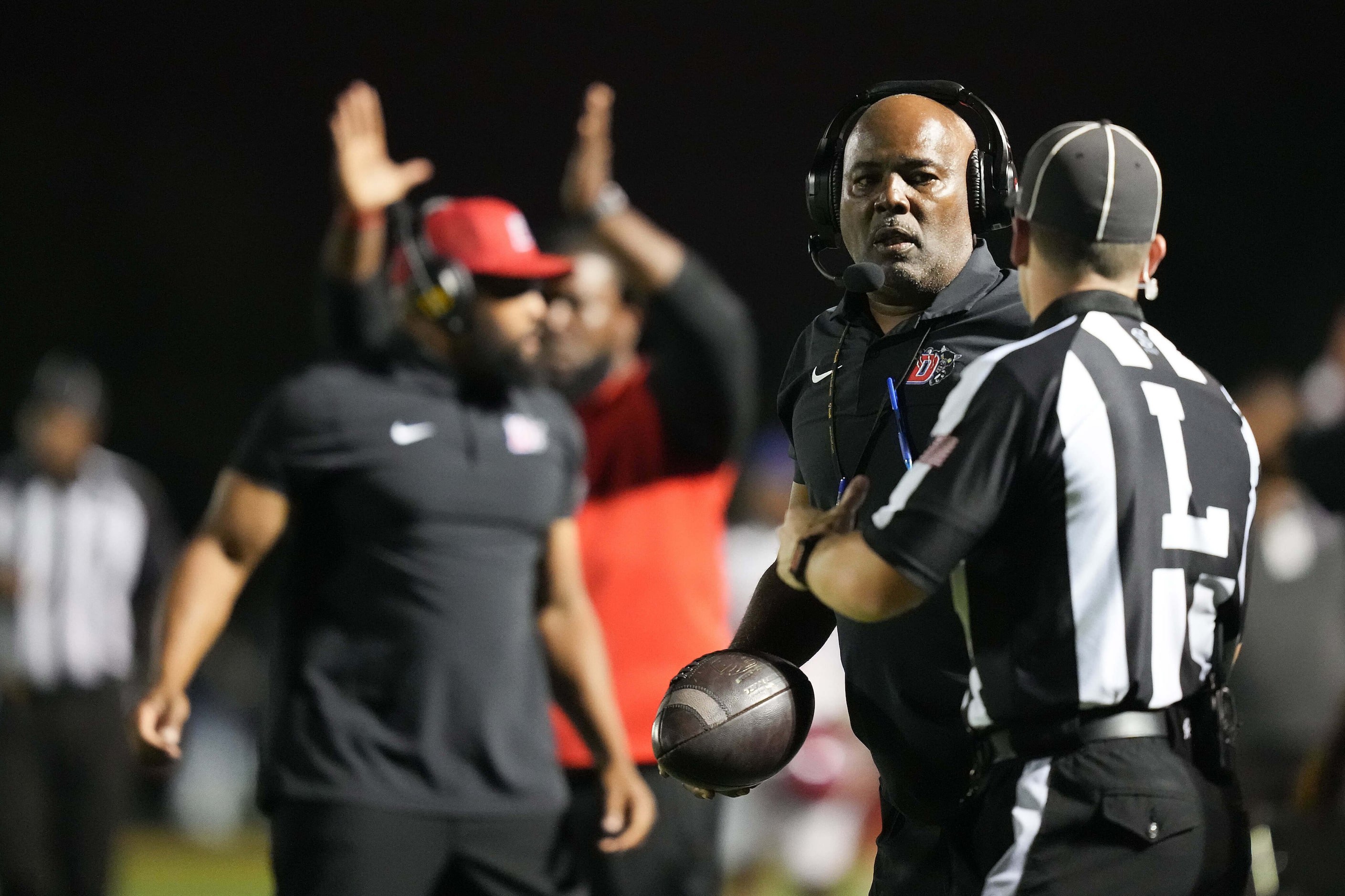 Duncanville head coach Reginald Samples questions a call during the first half of a District...