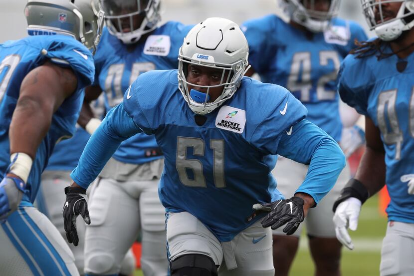 FILE - Detroit Lions defensive end Kerry Hyder Jr., runs a drill during NFL football...