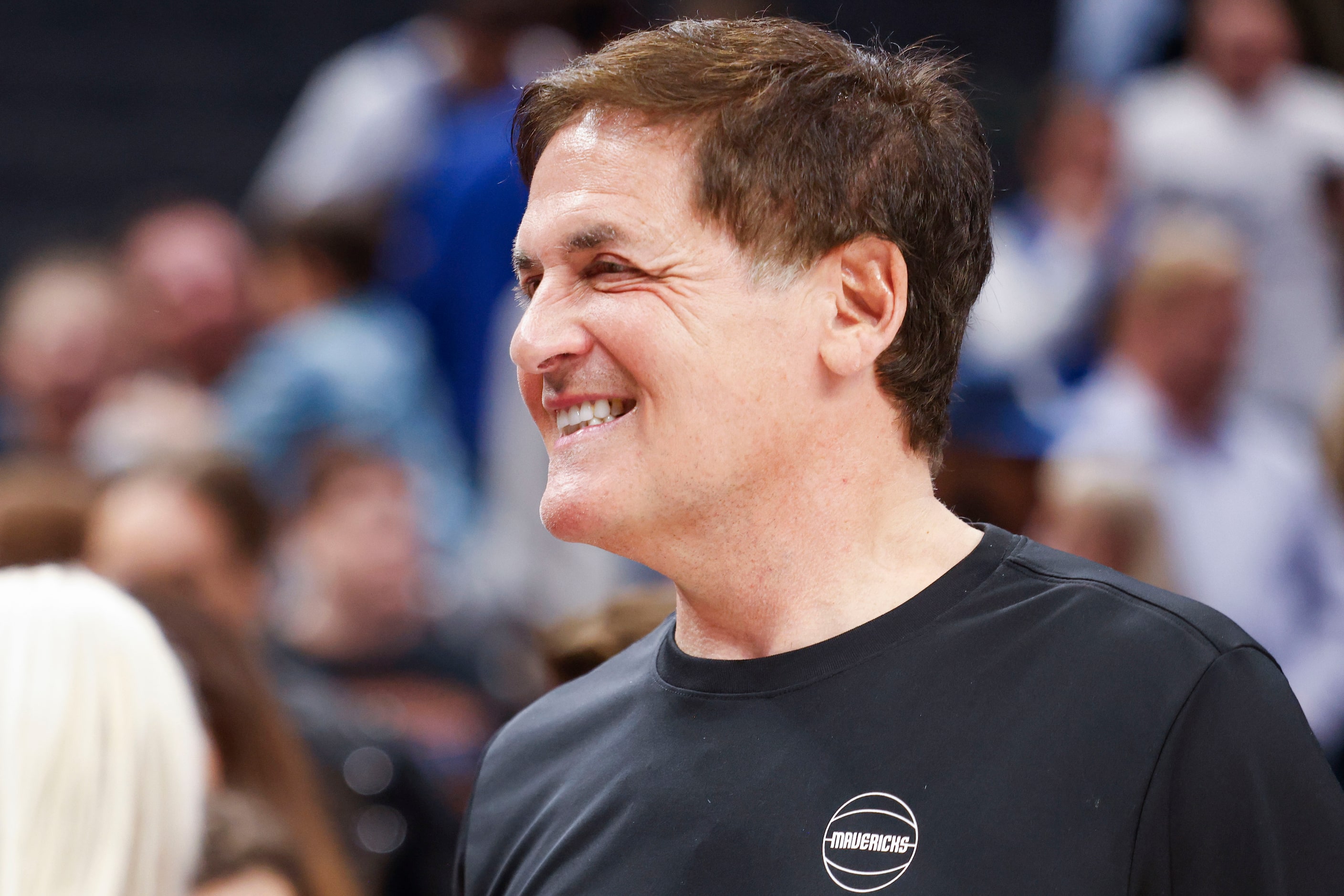 Dallas Mavericks alternate Governor Mark Cuban exits the court after an NBA basketball game...