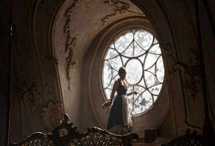 This image released by Disney shows Emma Watson as Belle in a live-action adaptation of the...