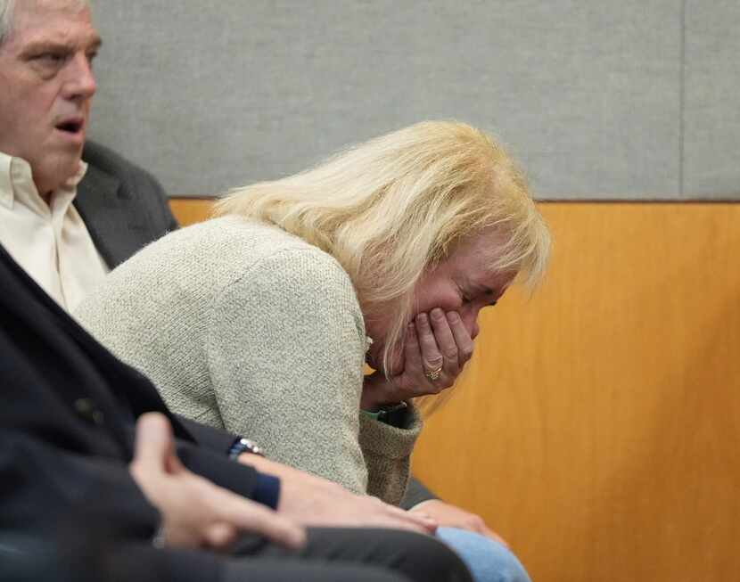The mother of U.S. Army Sgt. Daniel Perry cries after he was found guilty in the killing of...