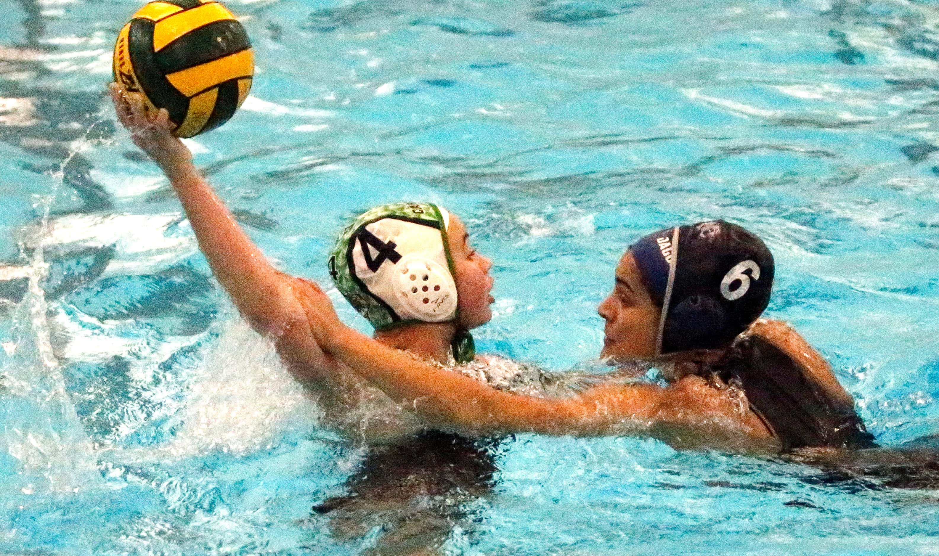 Southlake’s Maile Farden (4) makes a pass as Flower Mound’s Reva Joshi (6) makes contact...