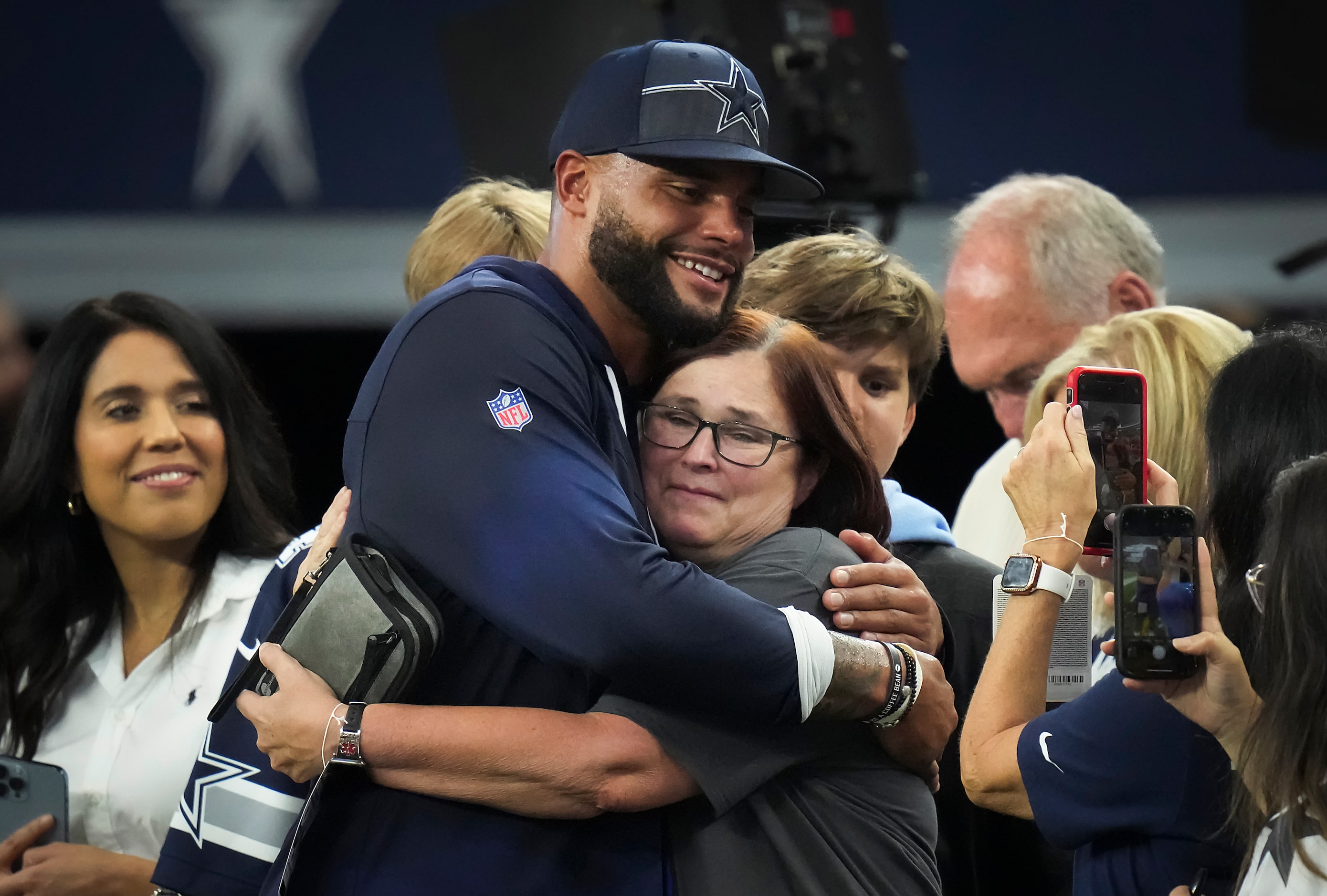 Dallas Cowboys quarterback Dak Prescott hugs his aunt Valrie Gilbeaux before an NFL...