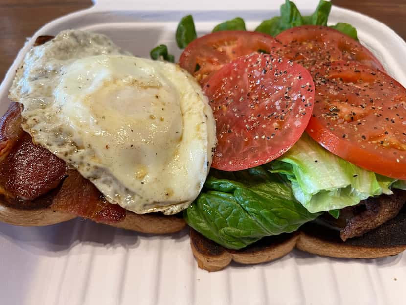The breakfast sandwich at Garden Cafe features classic tomato, egg and bacon.