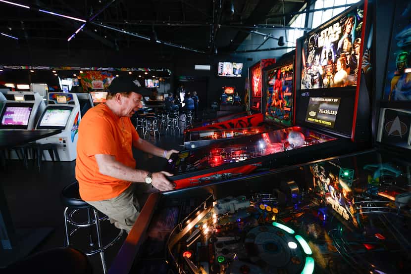 Kevin Cobb plays a Star Wars-themed pinball game at Free Play Arcade in the Trinity Groves...