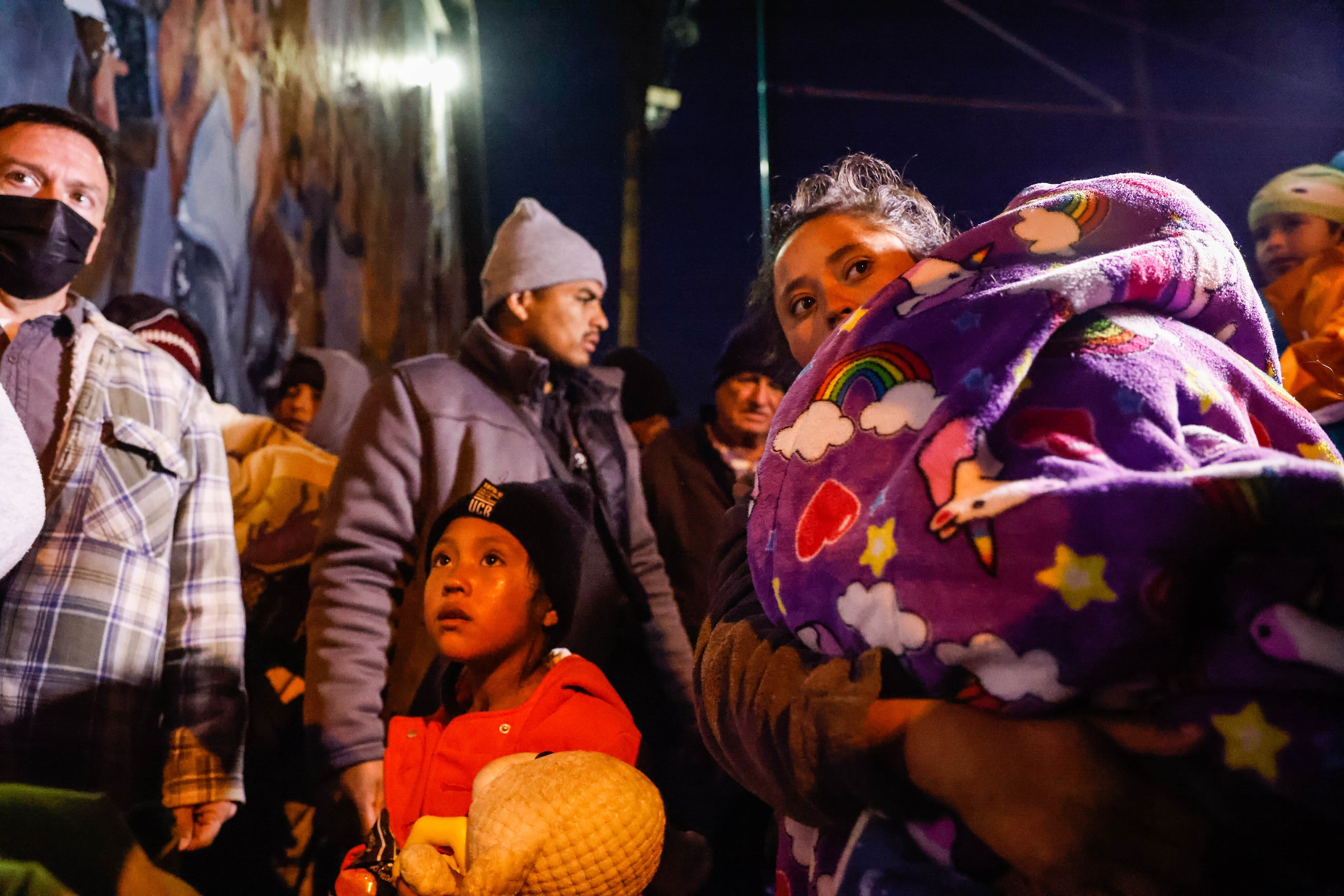 Migrants get inside the Centro Pastoral Sagrado Corazon in El Paso on Monday, Dec. 19, 2022....