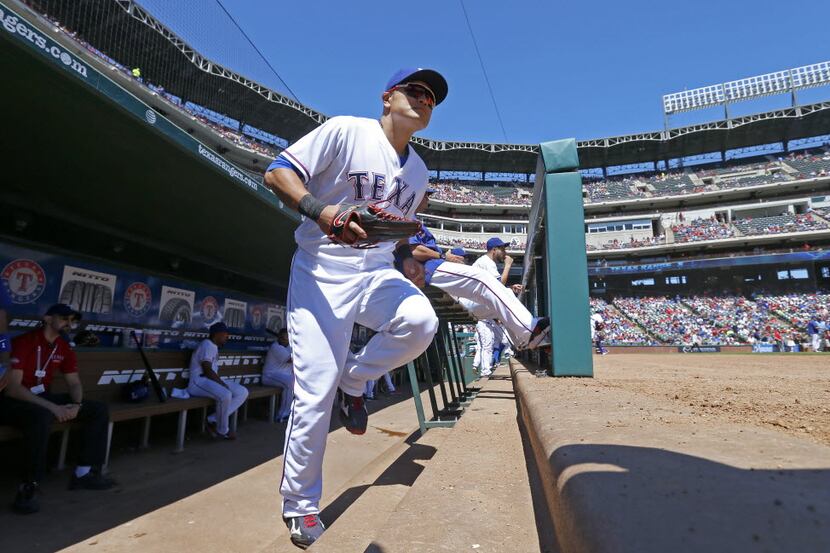 Texas Rangers right fielder Shin-Soo Choo (17) takes the field against Seattle Mariners at...