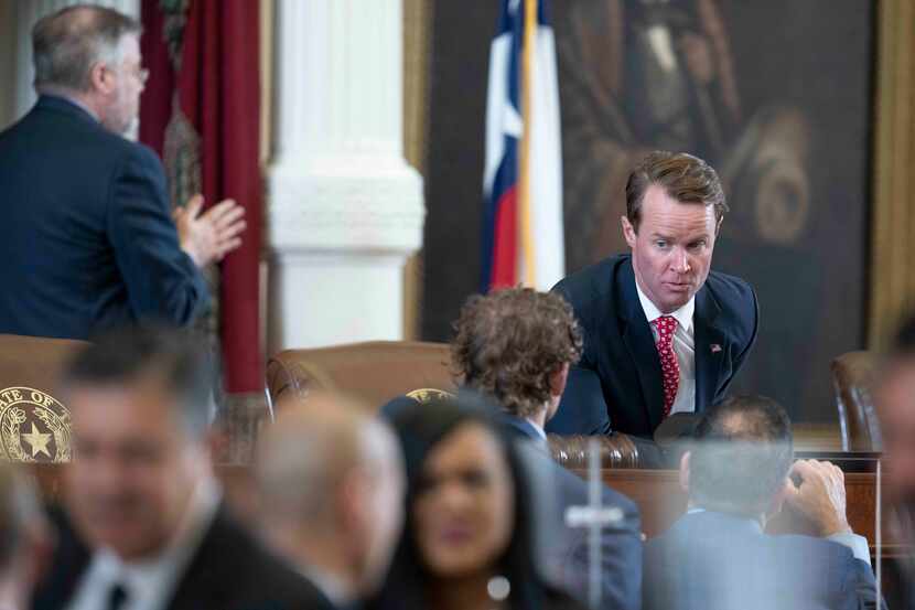 House Speaker Dade Phelan, R-Beaumont, talks with members in the final minutes of the 87th...