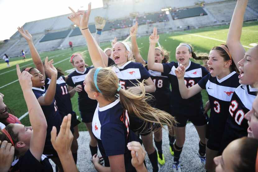 Members of the Sachse team cheer together before the start of the Class 5A first-round...
