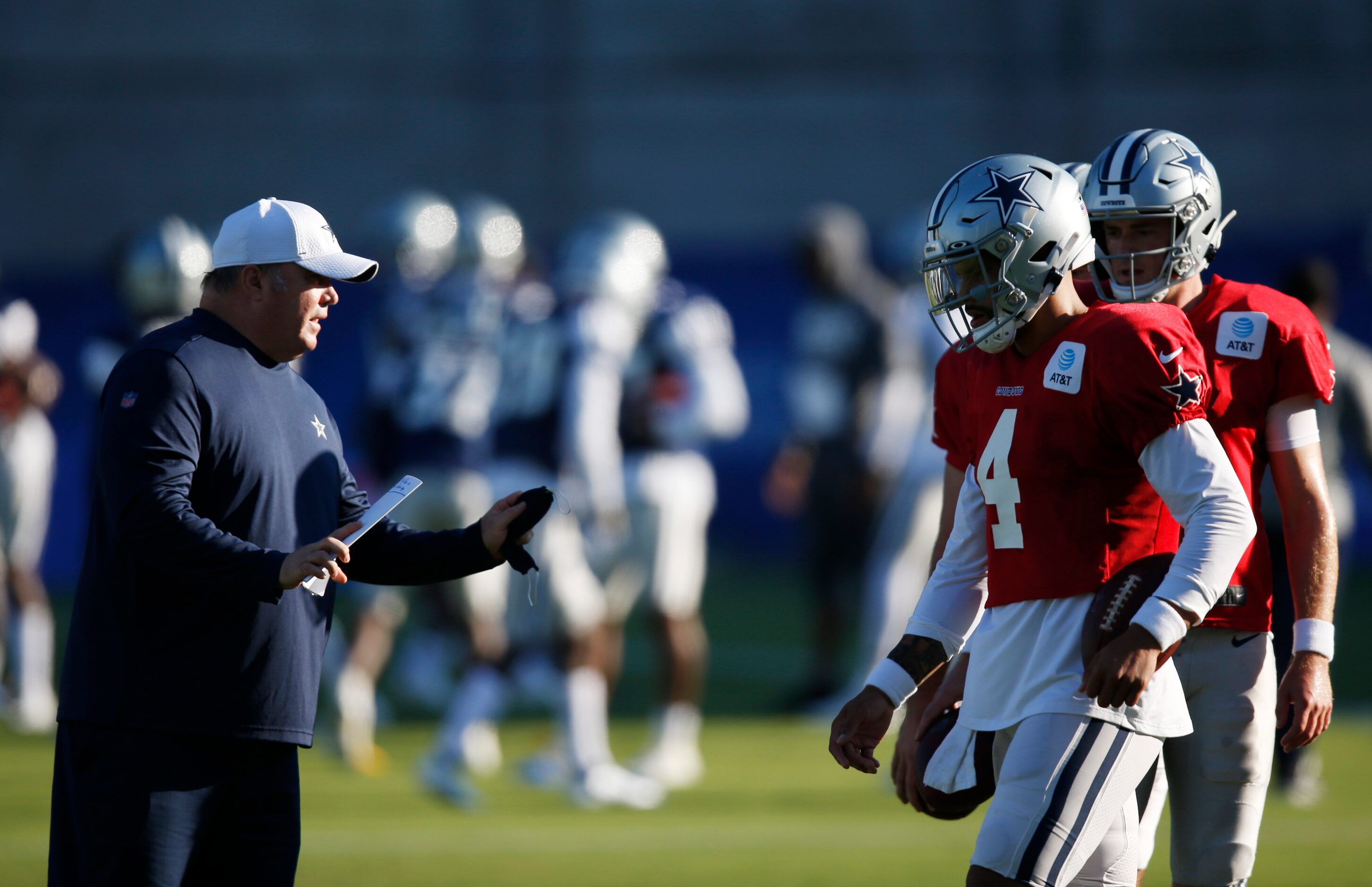 Dallas Cowboys head coach Mike McCarthy talks with Dallas Cowboys quarterback Dak Prescott...