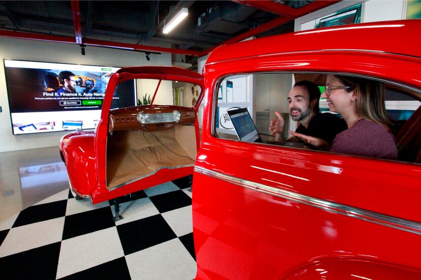 Capital One Financial Corp. employees collaborated in a vintage car while seeing their...