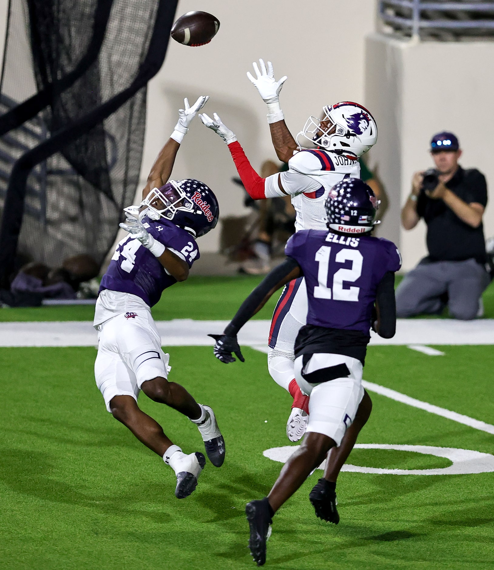 Richland wide receiver Xavier Johnson comes up with a reception over Denton Ryan defensive...