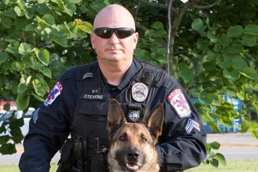The Baytown police K-9 that was stabbed in the face Monday pictured with his handler.