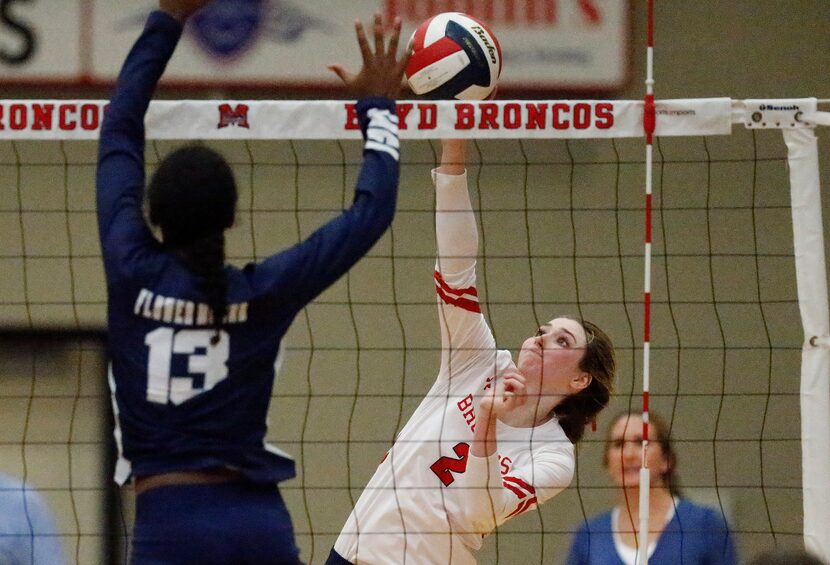 McKinney Boyd High School outside hitter Hannah Billeter (2) tries to get a hit as Flower...