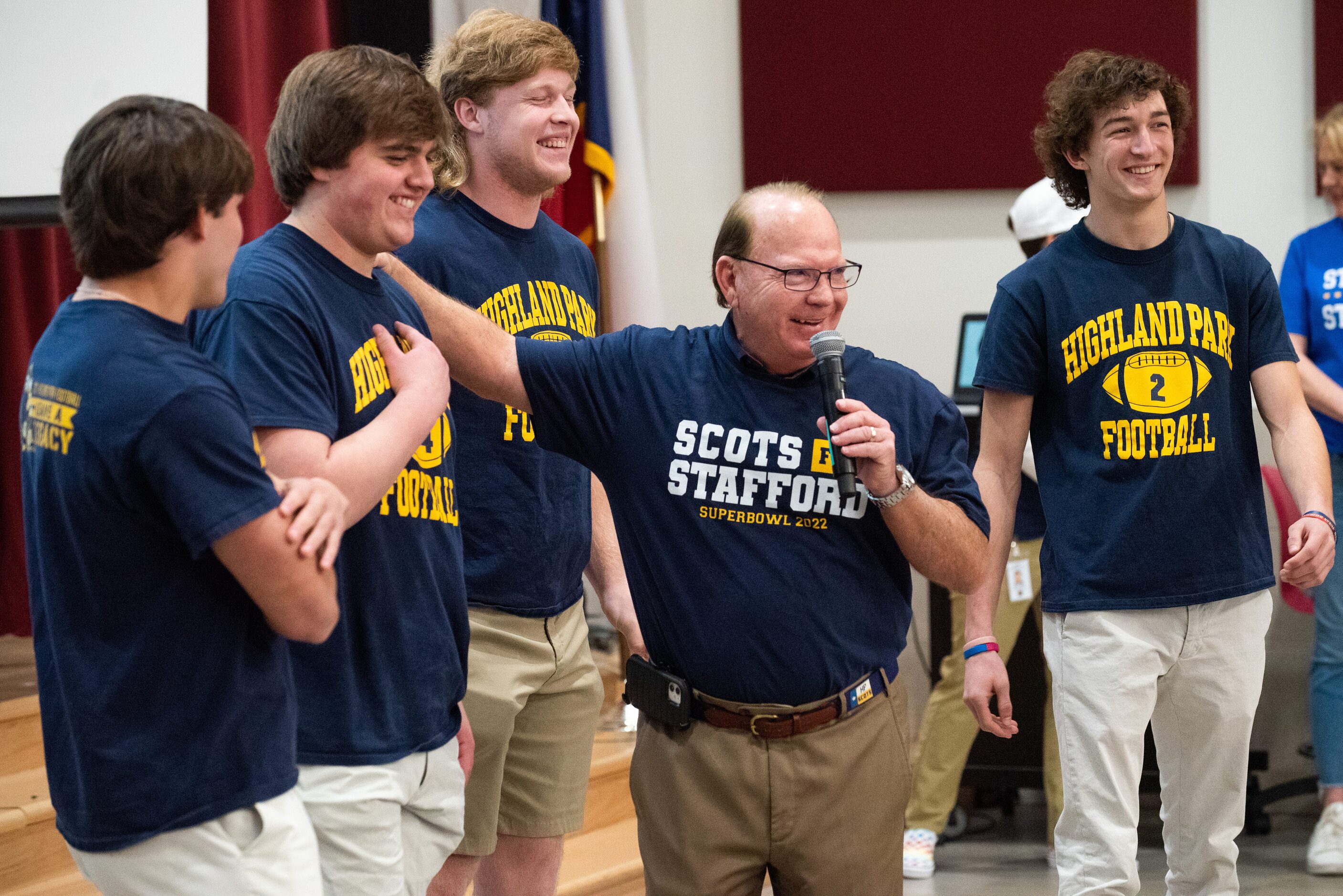 Highland Park High School head football coach Randy Allen, center, introduces members of his...