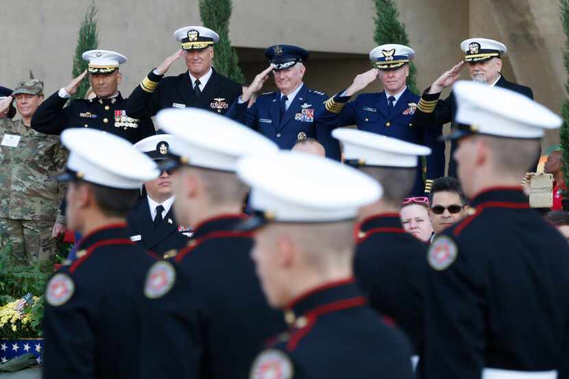 Top military brass saluted soldiers during the Dallas Veterans Day Parade in 2016. (Nathan...