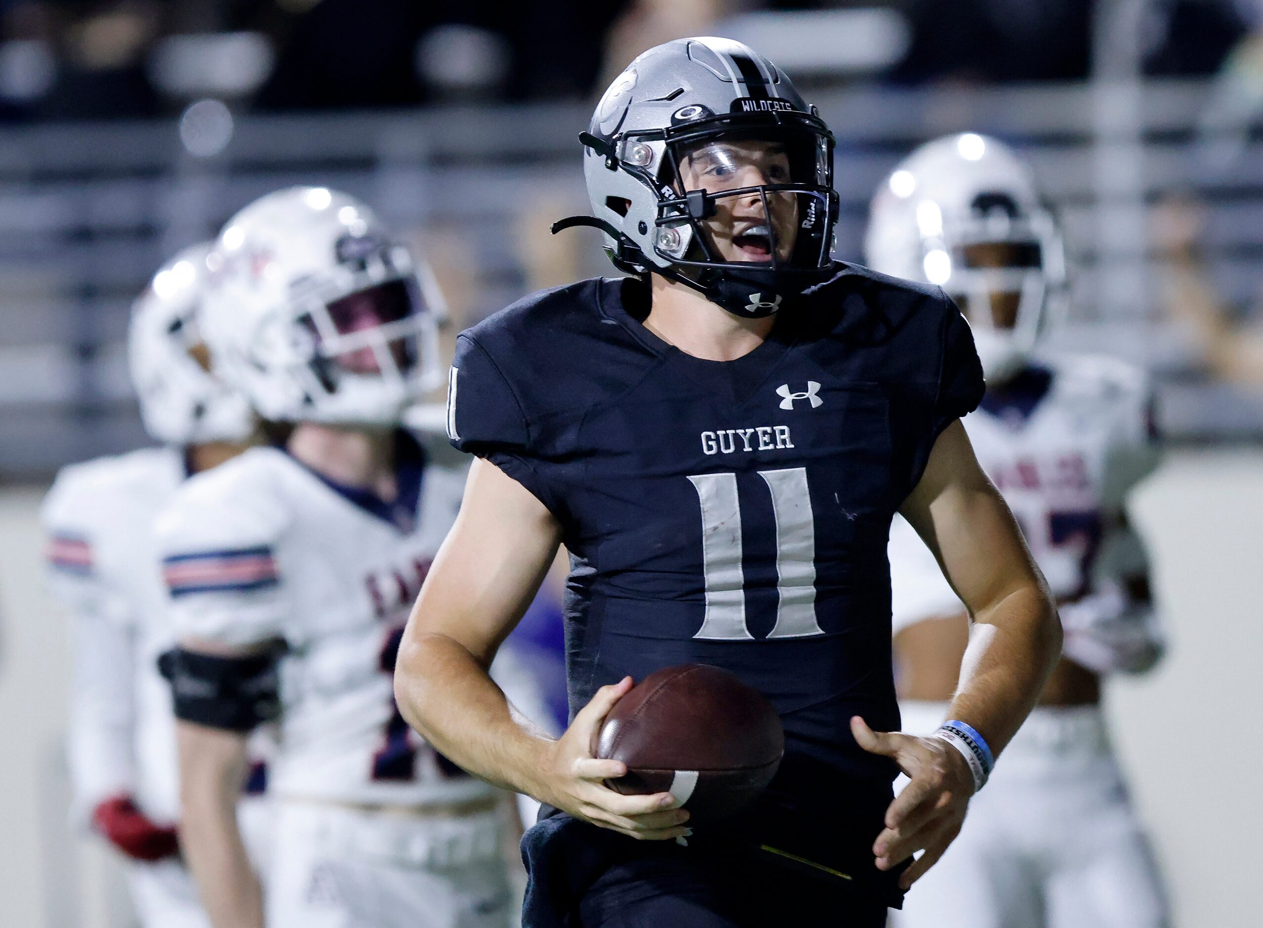 Denton Guyer quarterback Jackson Arnold (11) celebrates his long third quarter touchdown run...