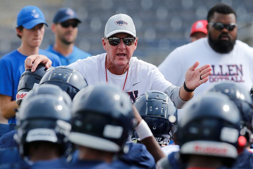 Allen High School head football coach Chad Morris talks to his team before practice after ...