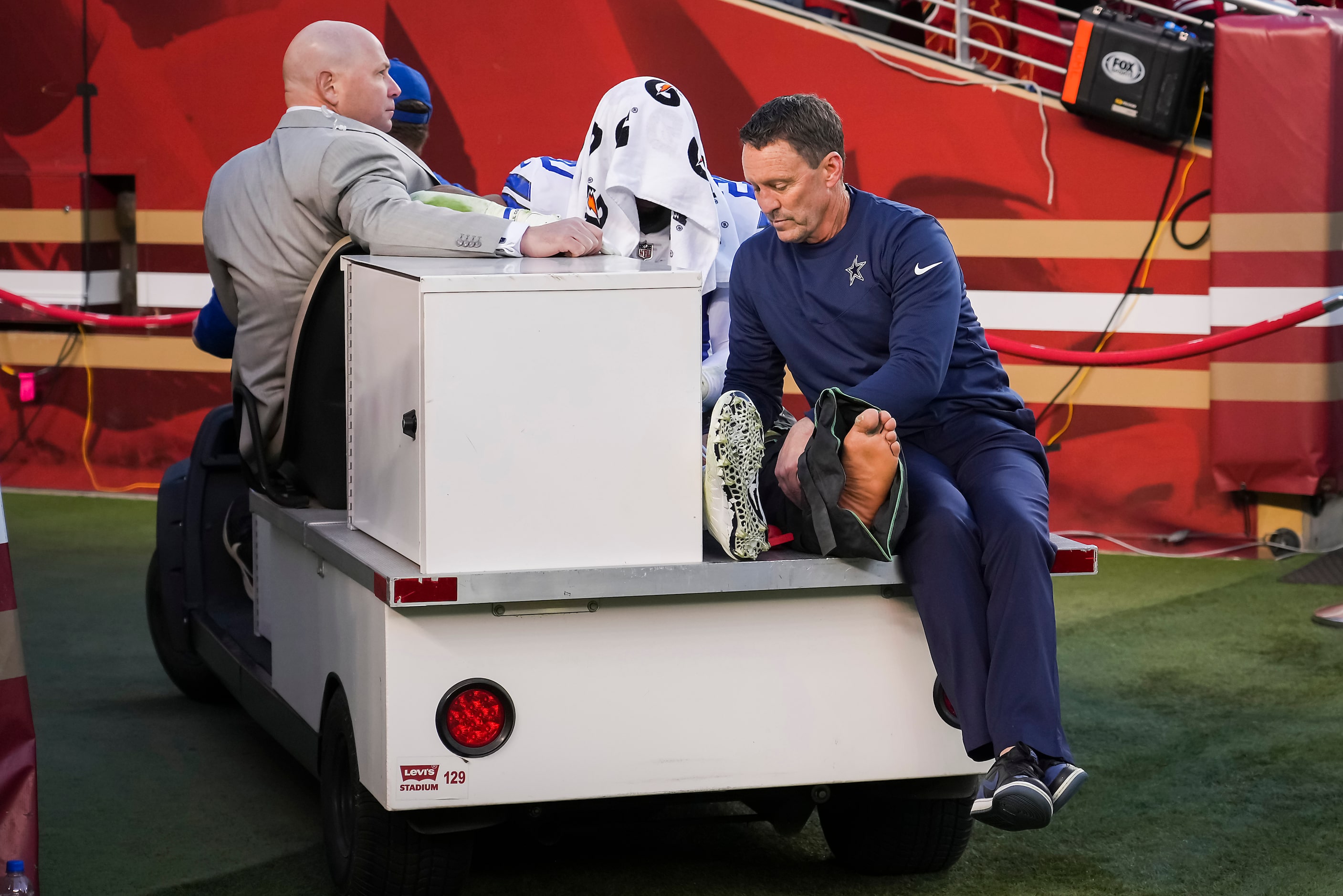 Dallas Cowboys running back Tony Pollard (20)  leaves the field on a cart after being...