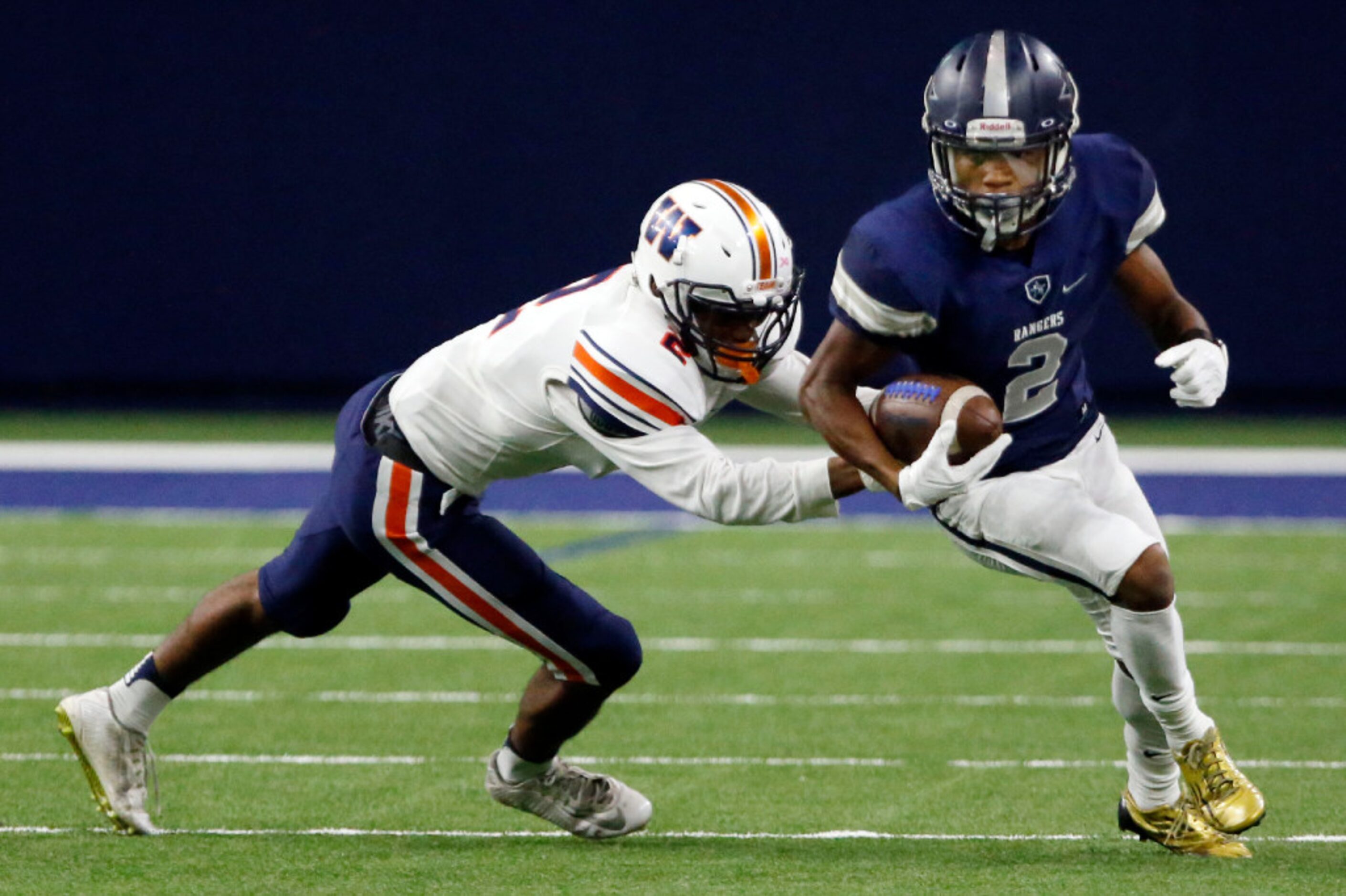 Frisco Lone Star WR Jaylen Dixon (2) tries to get around Frisco Wakeland High defender Louis...