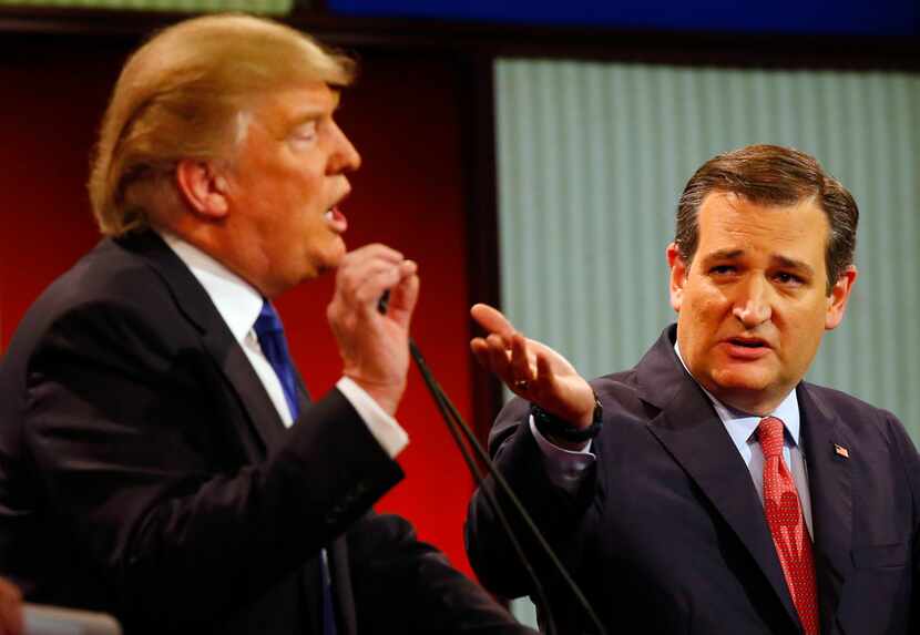 Republican presidential candidates Donald Trump and Ted Cruz argued a point during a...
