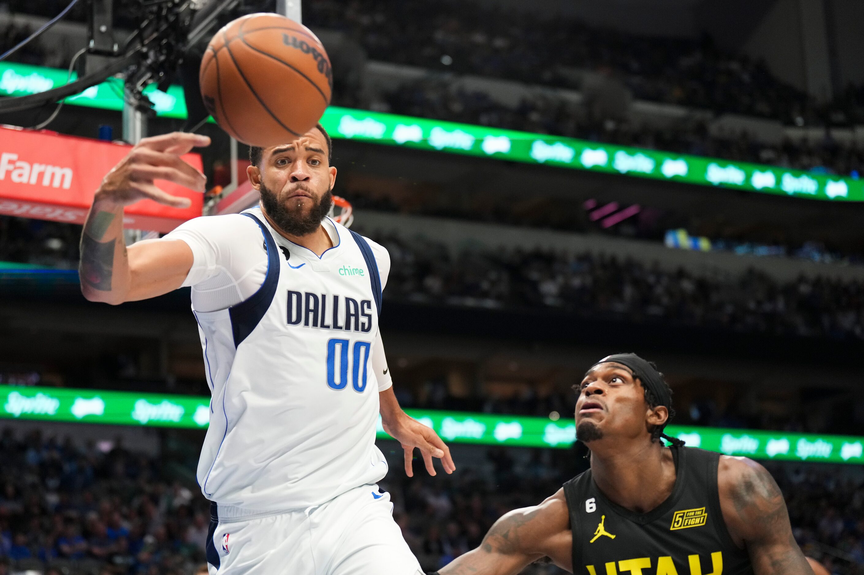 Dallas Mavericks center JaVale McGee (00) fights for a rebound against Utah Jazz forward...