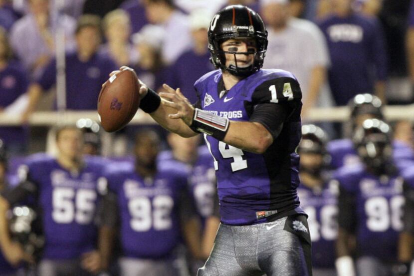 TCU quarterback Andy Dalton looks to throw the ball against Utah during the first half of an...