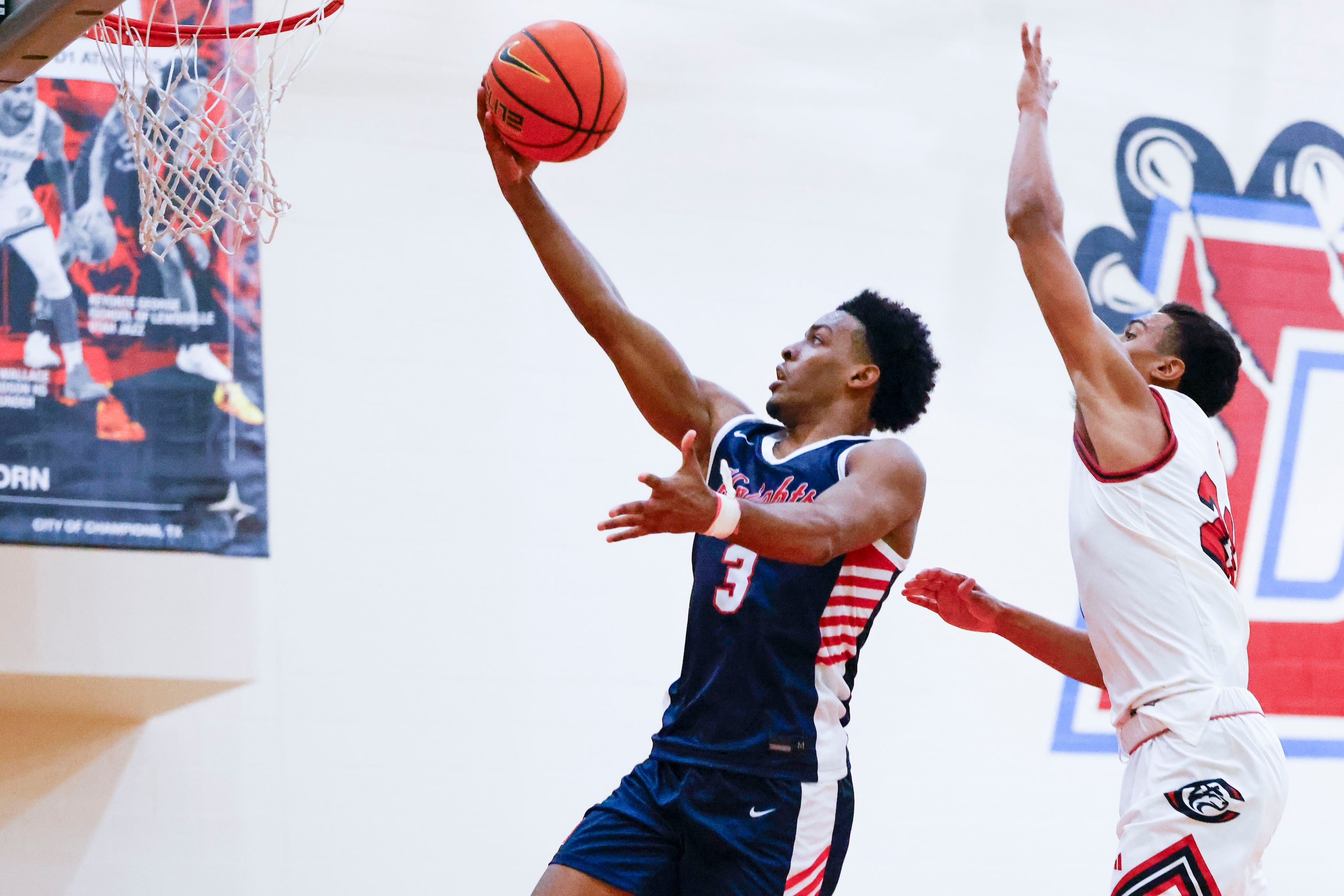 Kimball High’s David Coe (3) drives to the basket against Isaiah Rogers of Centennial High...