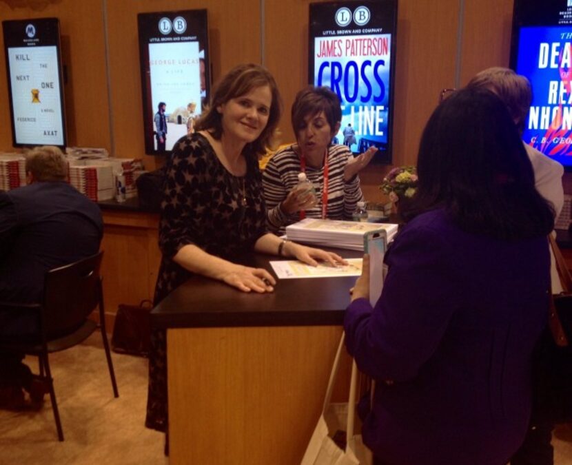  Maria Semple signs a promotional handout for "Today Will Be Different" at BookExpo America.