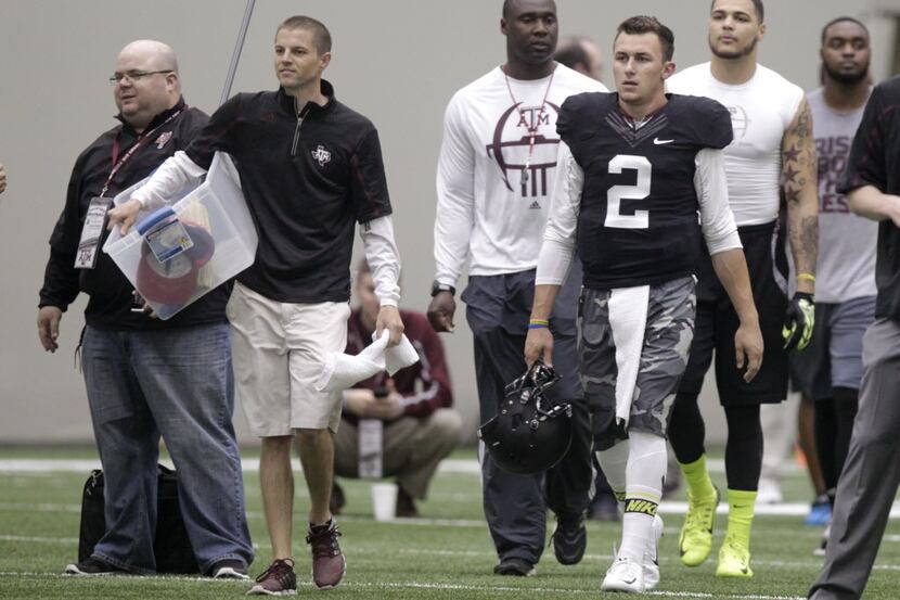 Texas A&M quarterback Johnny Manziel enters the McFerrin Athletic Center during pro day for...
