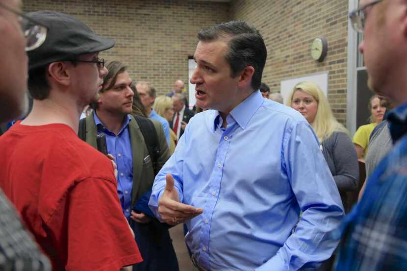  Sen. Ted Cruz speaks to members of his audience following a town hall event at Morningside...