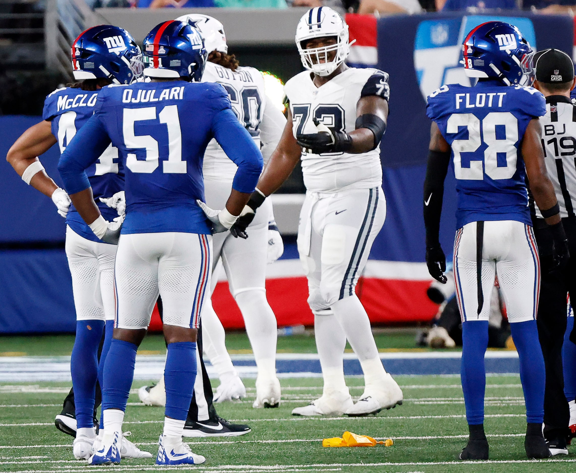 Dallas Cowboys offensive tackle Tyler Smith (73) reacts to a penalty flag thrown on his...