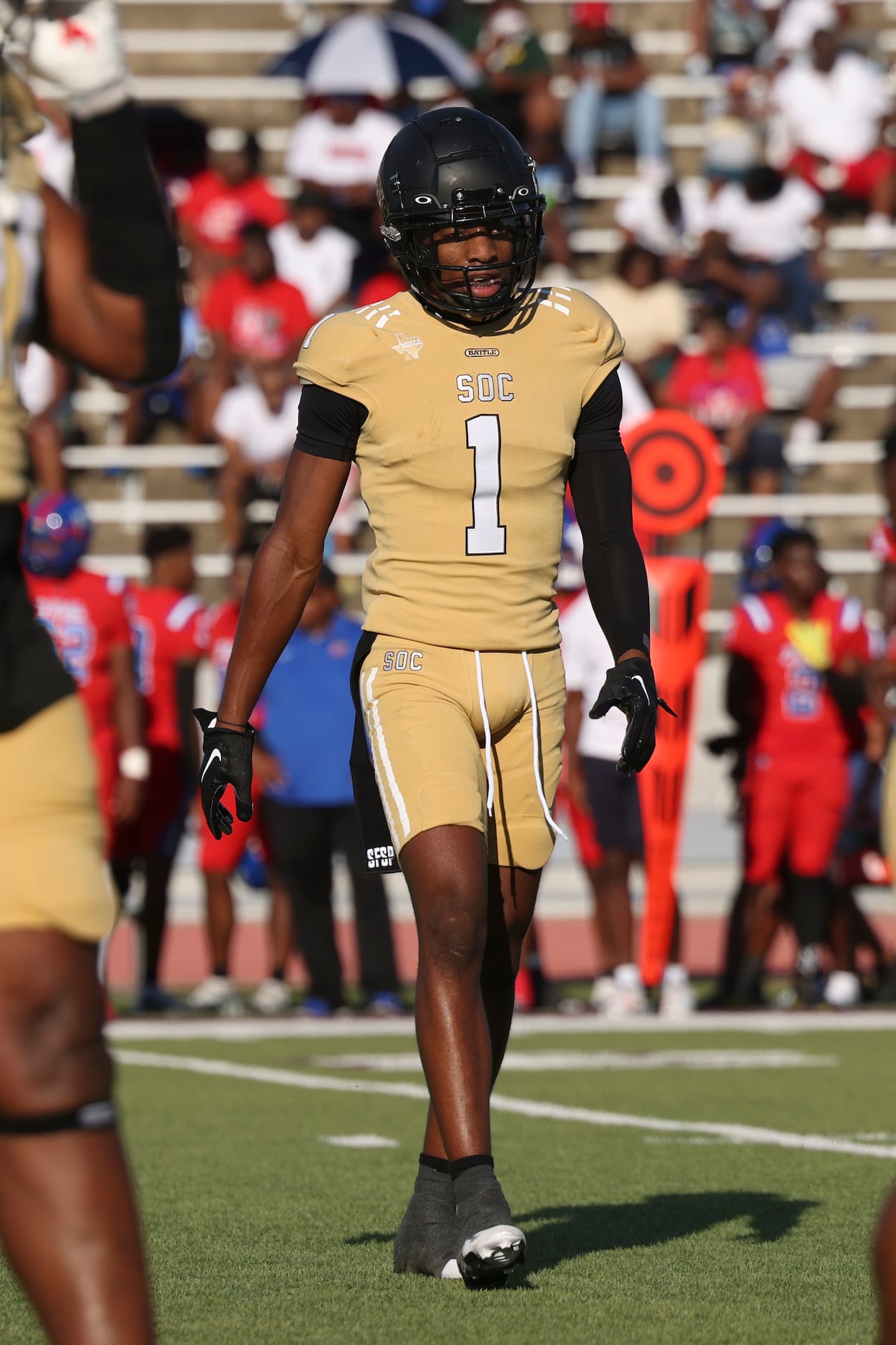 South Oak Cliff High School Manny Muhammad (1) walks off the field during the game between...
