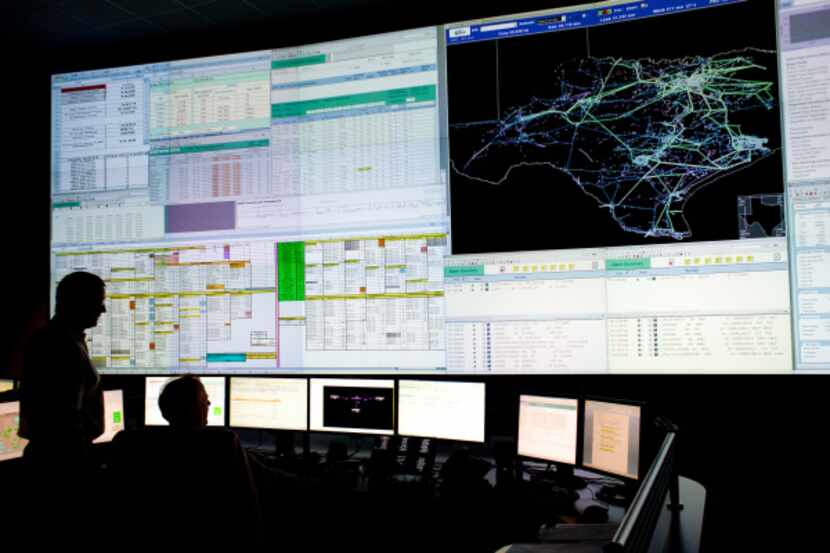 Operators monitor energy transmission at ERCOT's control center in Bastrop. For this...