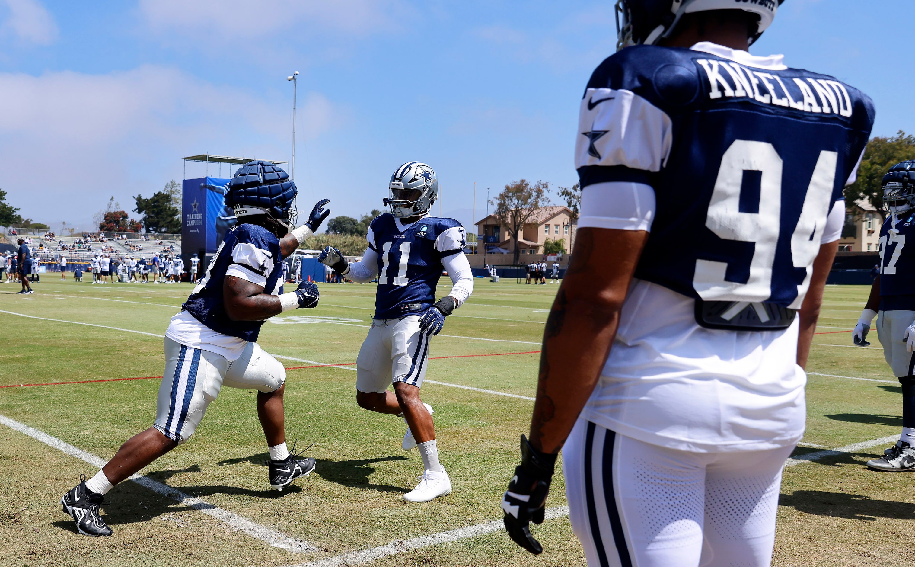 Dallas Cowboys defensive tackle Mazi Smith (58) lunges at linebacker Micah Parsons (11) with...